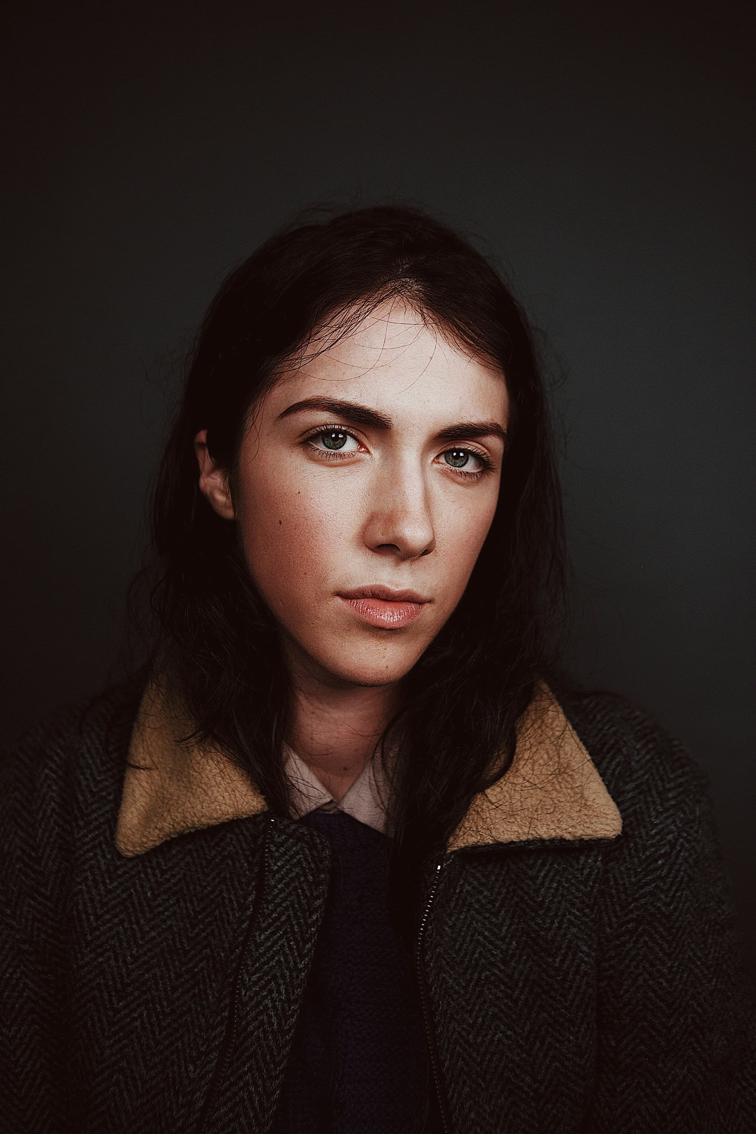 Portrait in a grey and brown coat