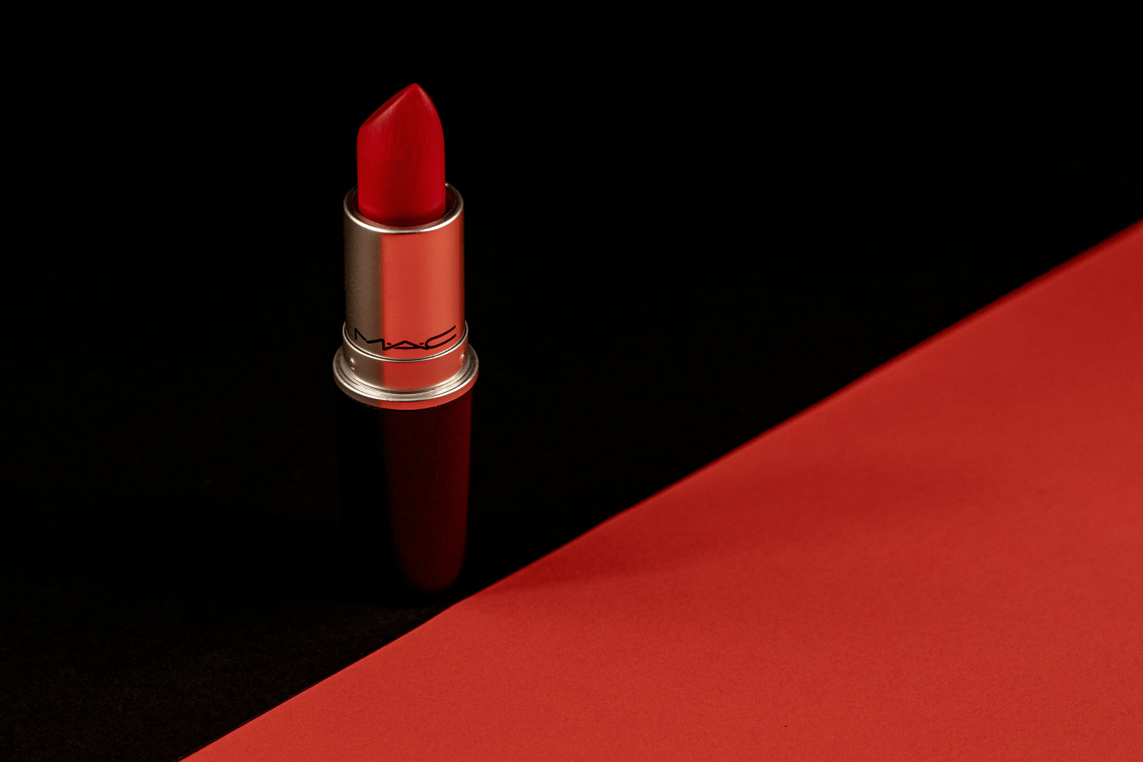 A red lipstick against black