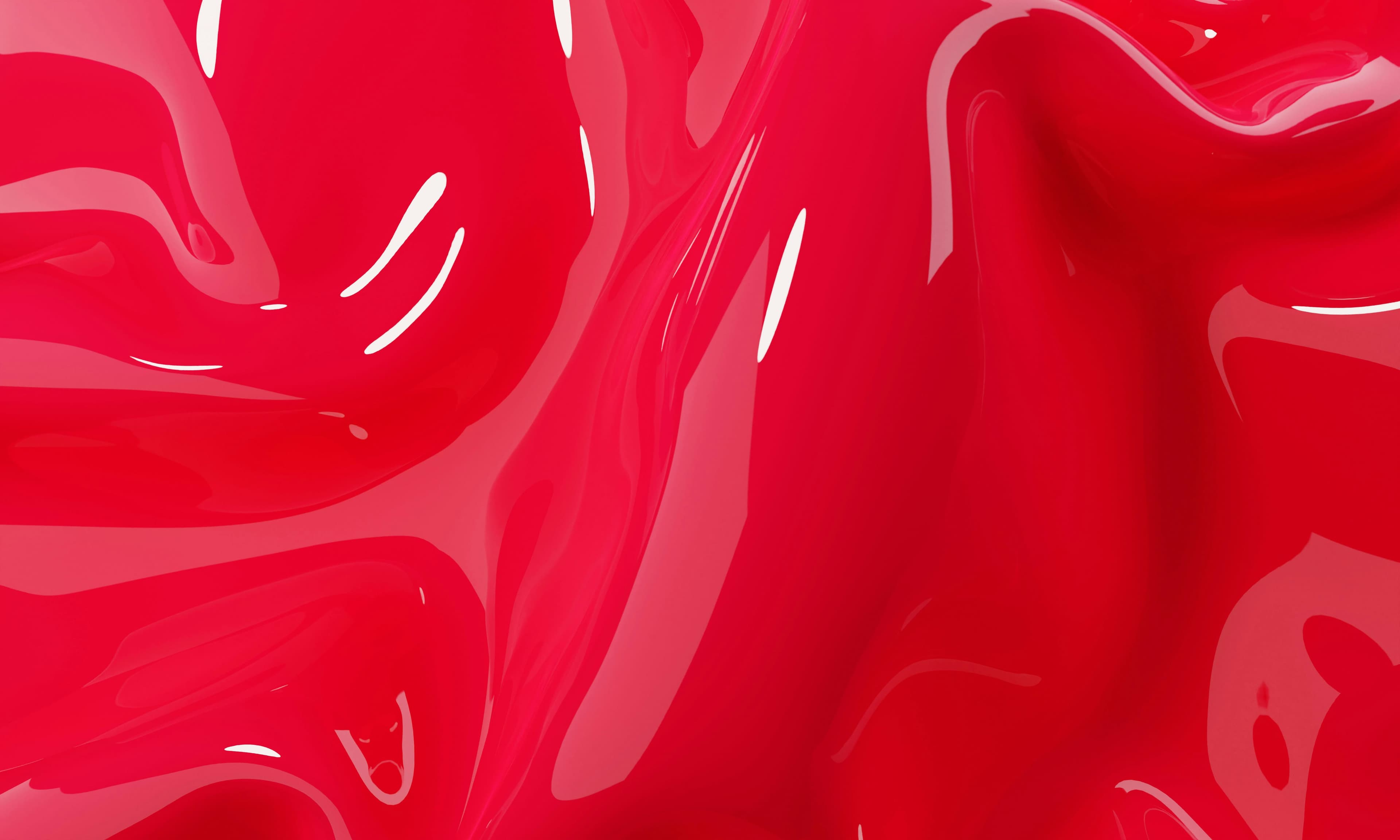 Glossy red liquid pigment, close up